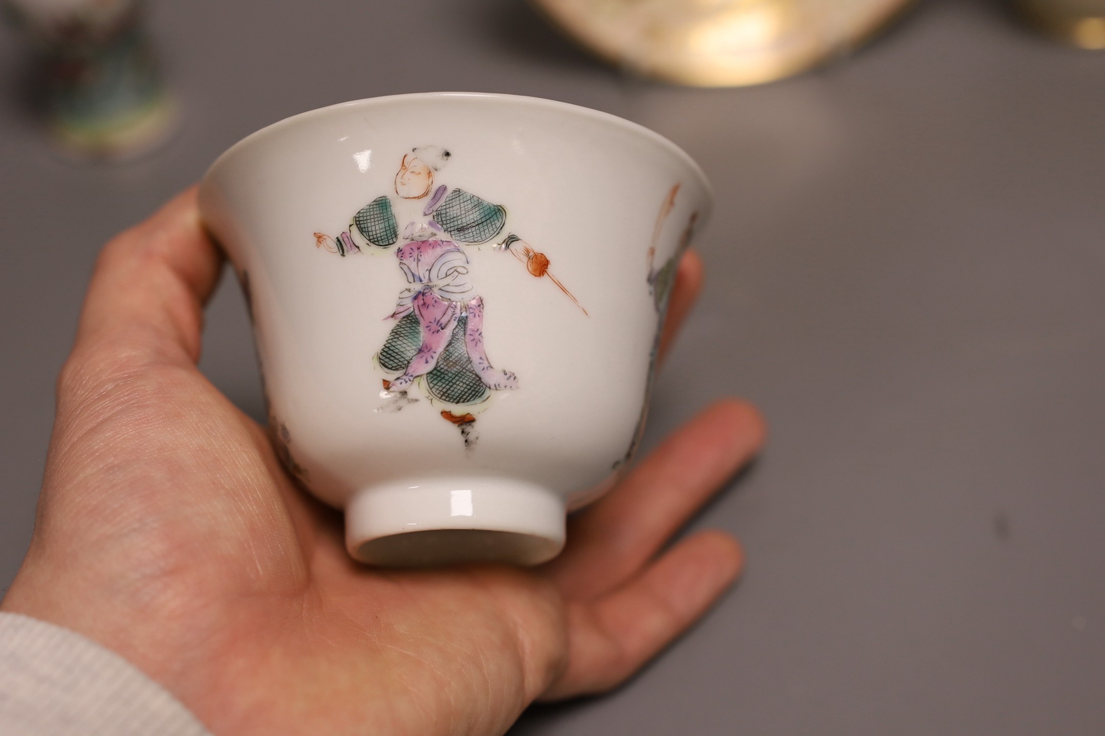 A Chinese famille rose tea bowl, similar small vase and a London shape coffee cup and saucer